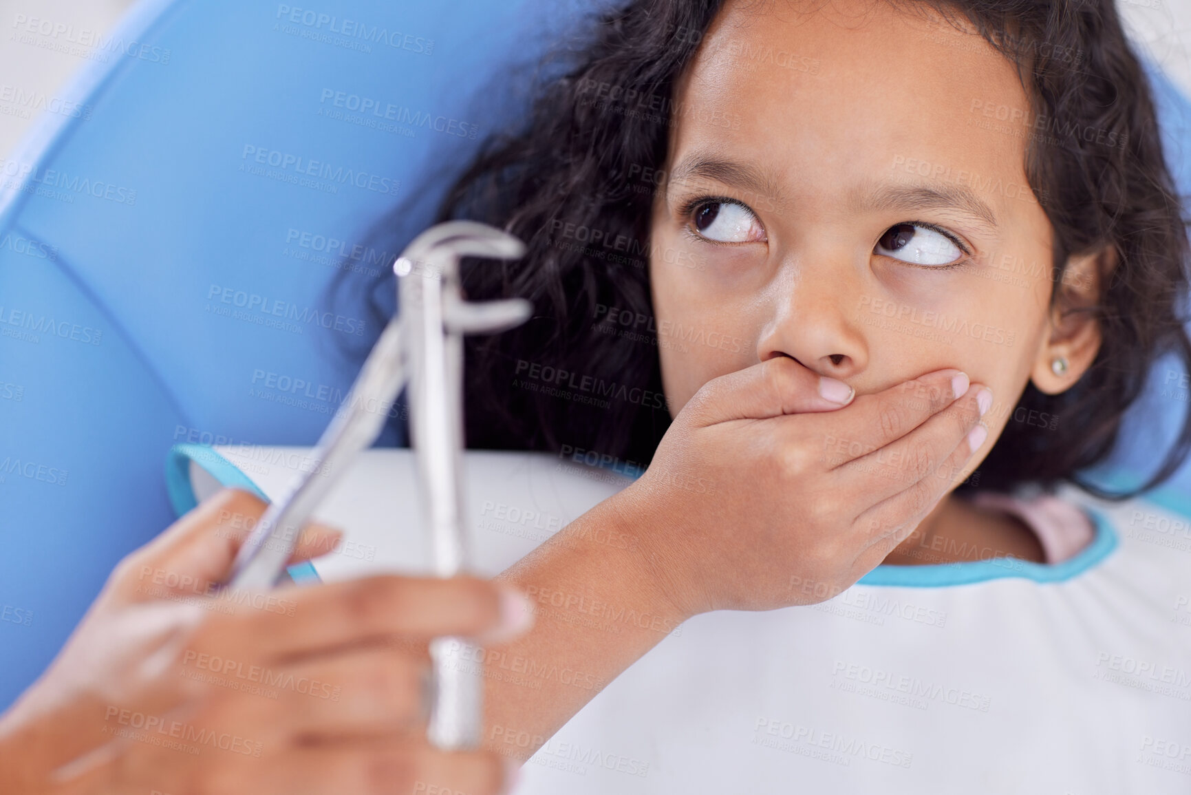 Buy stock photo Scared, child or hands of dentist with tool for dental health, teeth cleaning or cavity treatment for oral hygiene. Pediatric clinic, nervous girl or worried kid with fear for medical consultation