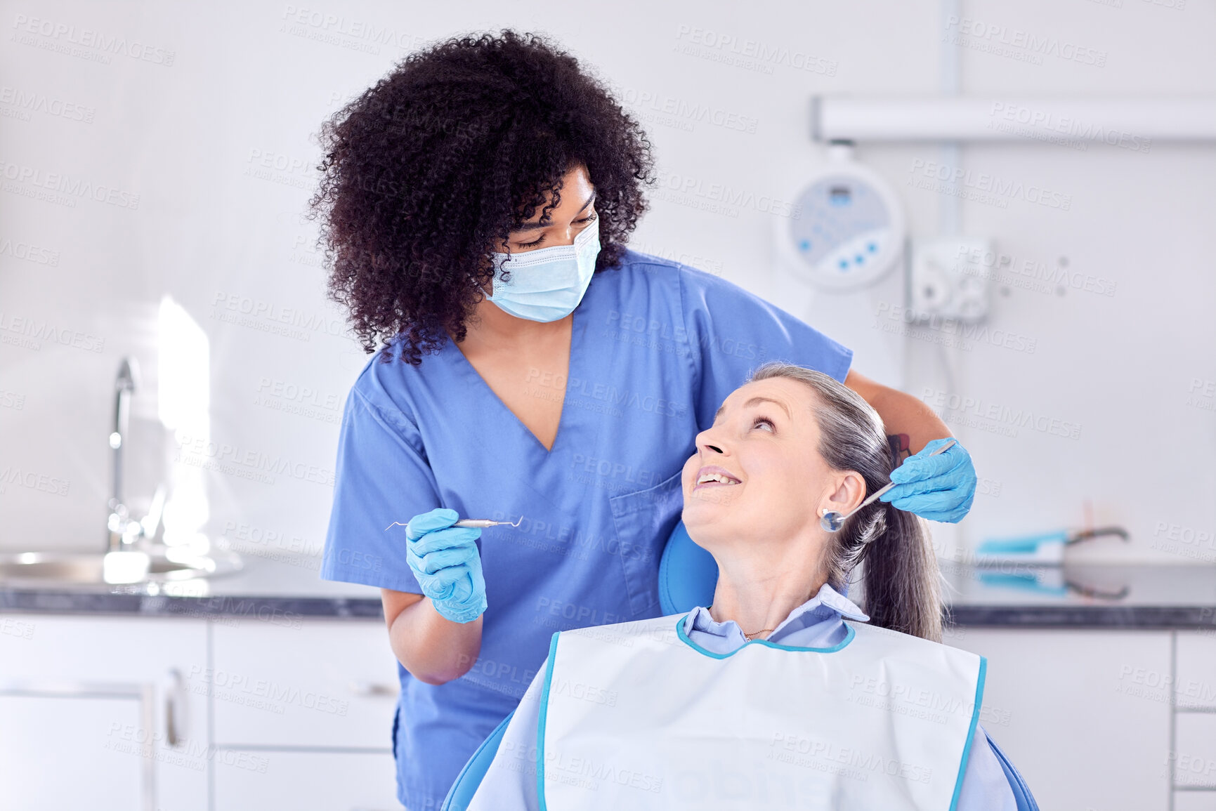 Buy stock photo Mature woman, patient and dentist with smile for oral care in clinic for teeth whitening and treatment. People, satisfied and happy on consultation for canal procedure or dental surgery with doctor
