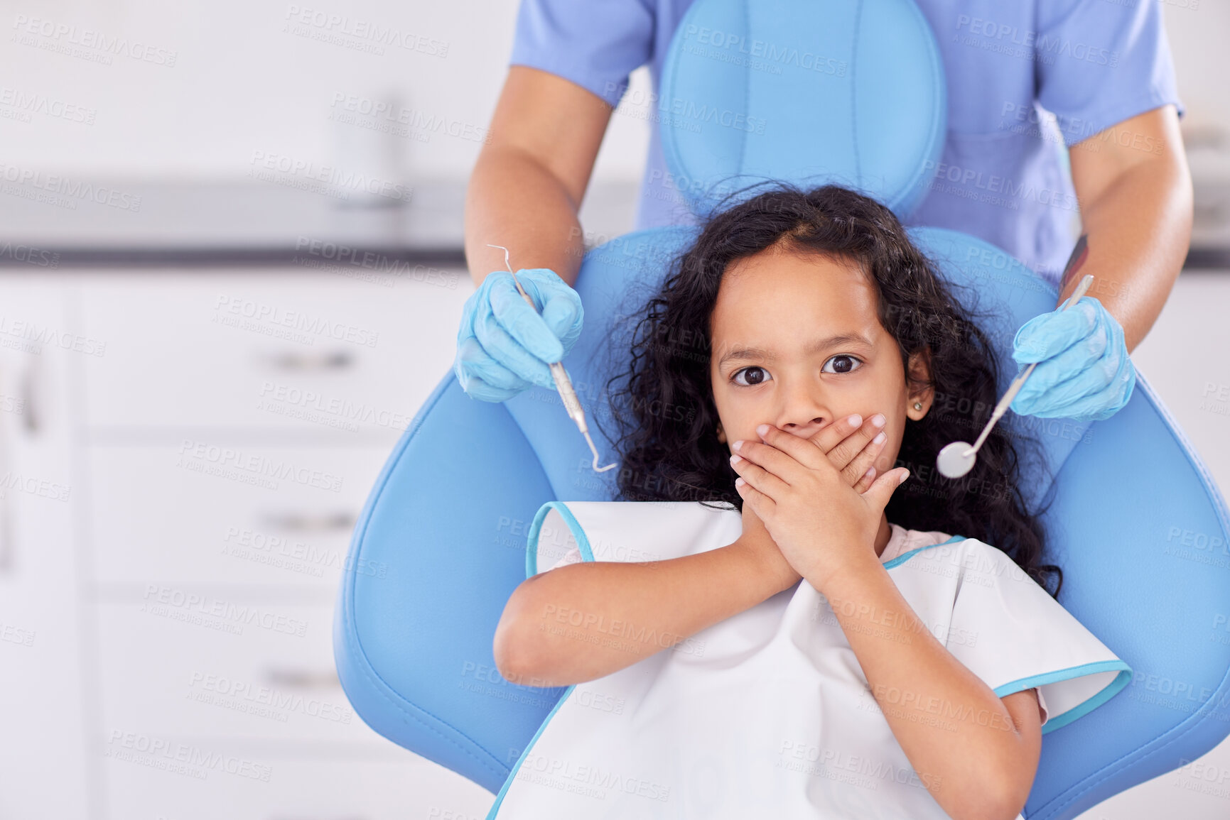 Buy stock photo Nervous kid, portrait or hands of dentist with tool for dental health, teeth cleaning or cavity treatment for oral hygiene. Pediatric clinic, worry or scared child with fear for medical consultation