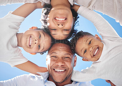 Buy stock photo Shot of a beautiful young family bonding outside