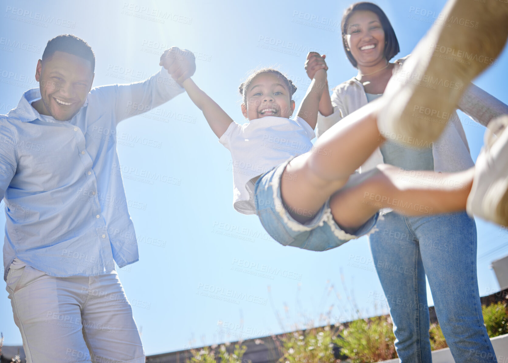 Buy stock photo Shot of a young fmaily playing outside