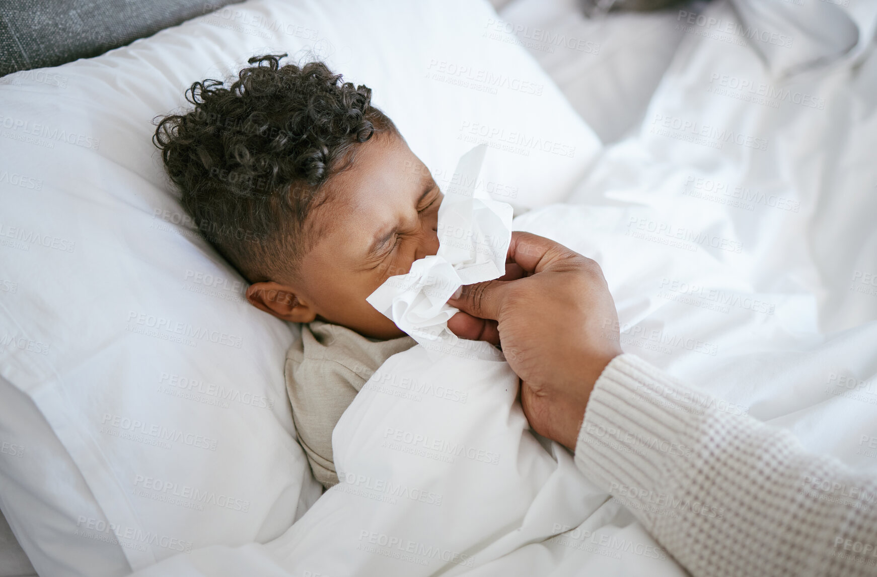 Buy stock photo Sick, kid and parent in bed with tissue for cold, flu or infection in home for child healthcare. Illness, person and boy in bedroom with fever, blowing nose and recovery with health in homecare