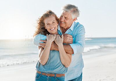 Buy stock photo Senior, couple and portrait hug by the ocean with happiness and love on holiday in the outdoor. Mature, man and woman at the beach hugging on vacation with smile for travel together with sunshine.