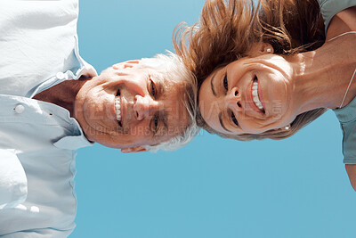 Buy stock photo Shot of a mature couple looking down at the camera
