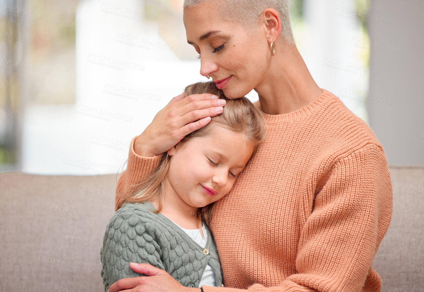 Buy stock photo Care, hug and mother with child on sofa for trust, love and bonding together for comfort in family home. Mom, girl and embrace kid in lounge for support, connection or relationship with parent