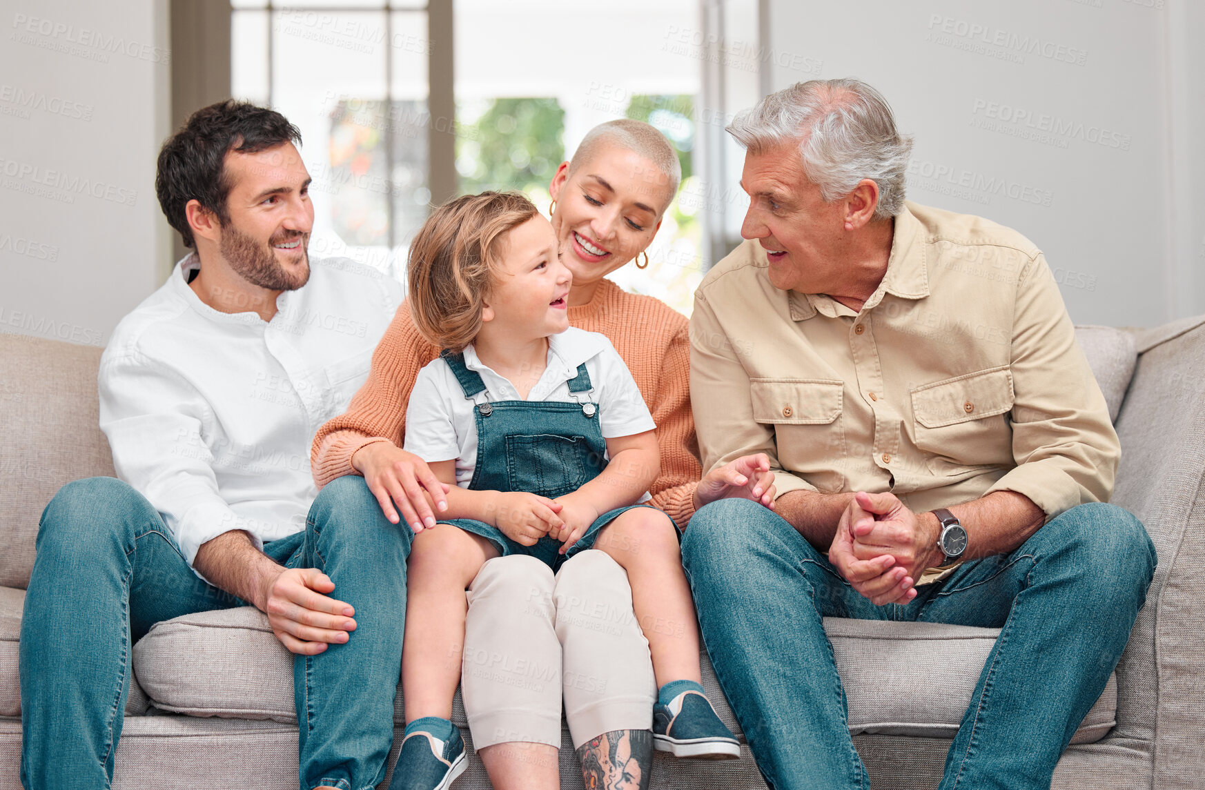 Buy stock photo Family, happy and generations on sofa for relax, bonding and visit to retirement home. Parents, elderly man and child in living room for funny story, relationship development and chatting on couch