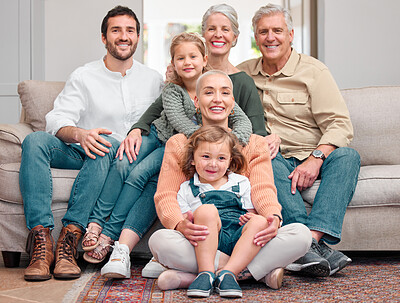 Buy stock photo Portrait of a happy family bonding on the sofa at home