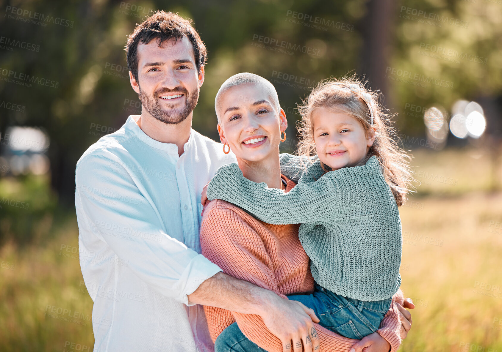 Buy stock photo Hug, portrait and smile with family at park together for adventure, bonding or love in summer. Safety, security or trust with happy mother, father and girl child embracing outdoor in countryside