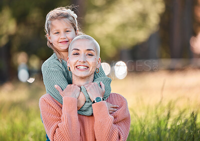 Buy stock photo Shot of a little girl spending the day outdoors with her mother