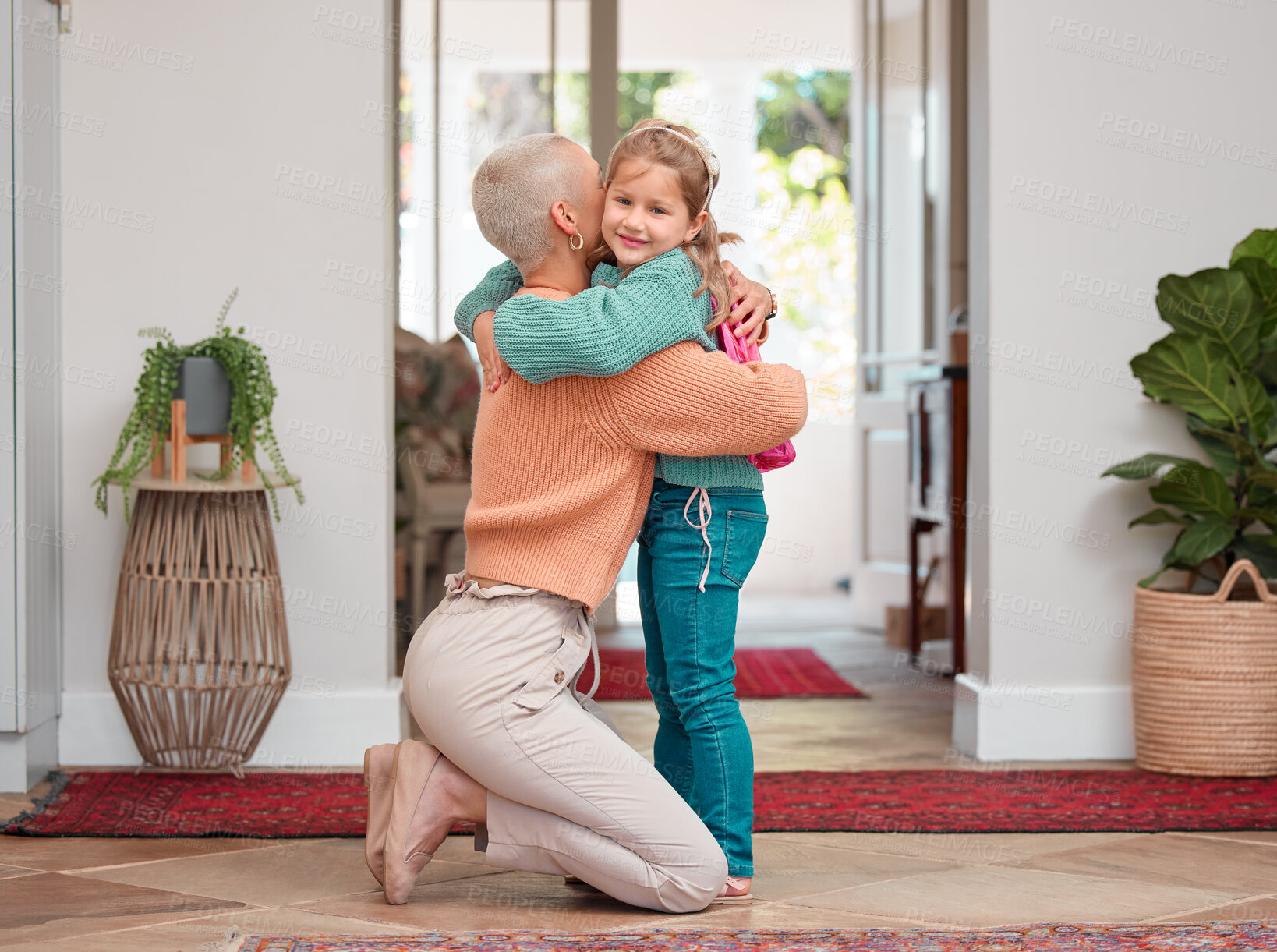 Buy stock photo Shot of a woman seeing her daughter off before school