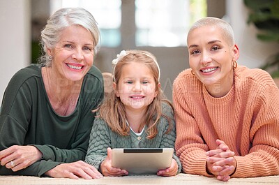 Buy stock photo Portrait, smile and tablet with family in living room of home together for education or streaming. Girl, happy grandma and mother on floor in apartment for child development, growth or learning