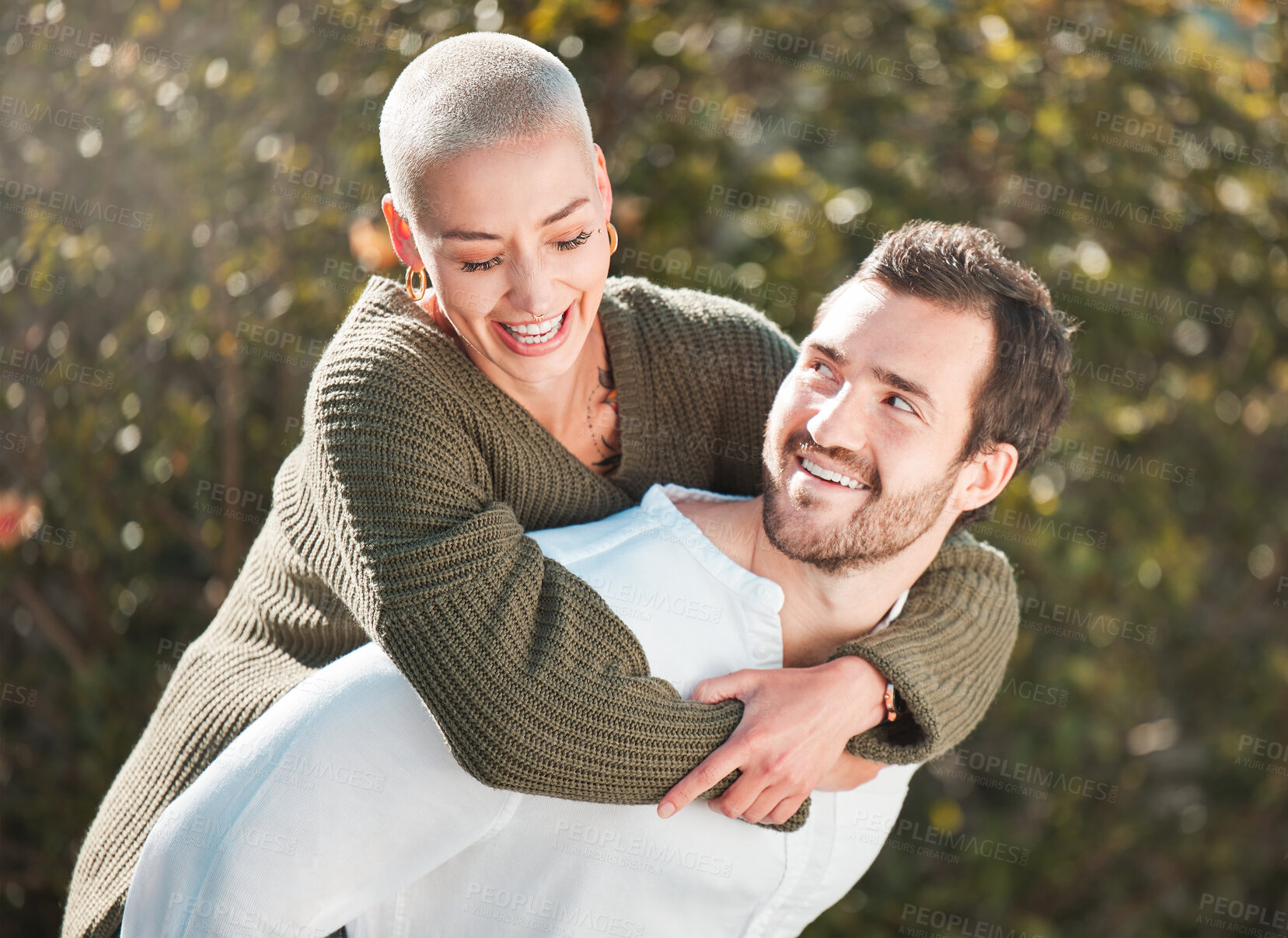Buy stock photo Piggyback, happy couple and outdoor with love for support, trust and commitment in relationship. Man, excited woman and carry in park for bonding, freedom and fun energy on anniversary adventure 