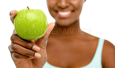 Buy stock photo Diet, studio and hand of black woman with apple for detox, wellness and benefits of natural food. Digestion, gut health and girl with smile, nutrition and balance with green fruit on white background