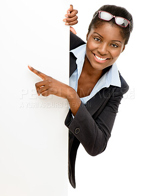 Buy stock photo Pointing, mockup poster and portrait of a black woman isolated on a white background in a studio. Happy, presentation and an African business ambassador with a blank sign for information space