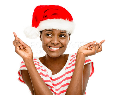 Buy stock photo Christmas, hat and black woman in studio with fingers crossed for holiday, vacation and festive season. Excited, happy and person with emoji for wishing, luck and celebration on white background