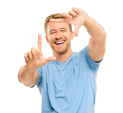 Buy stock photo Laugh, frame and portrait of man in studio with smile for confidence, pride or positive attitude. Happy, finger and isolated person with hands for photography, picture or selfie on white background