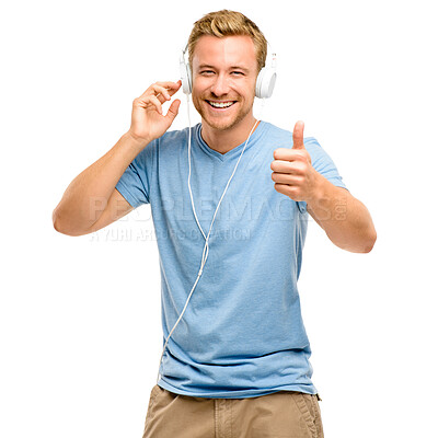 Buy stock photo Man, headphones and thumbs up in studio portrait with music, listening and smile by white background. Person, voice and audio tech for streaming, subscription and yes with icon, agreement and sign