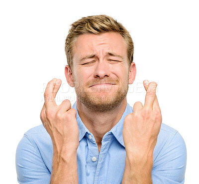 Buy stock photo Excited, fingers crossed and face of man in studio for winning, wish or hope for bonus. Emoji, luck and isolated person with hand sign for competition, good news and promotion on white background