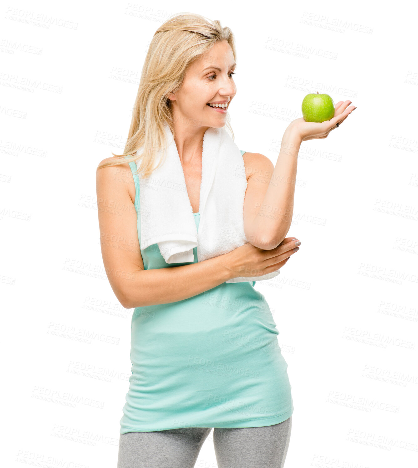 Buy stock photo Apple, fitness and towel with a senior woman in studio isolated on a white background for health. Exercise, nutrition and diet with a happy mature female athlete holding fresh fruit for weightloss