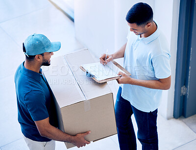 Buy stock photo Shot of a man signing for a package delivery