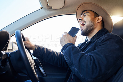 Buy stock photo Shot of a young man singing in the car