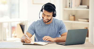 Buy stock photo Shot of a young male call center agent working in an office