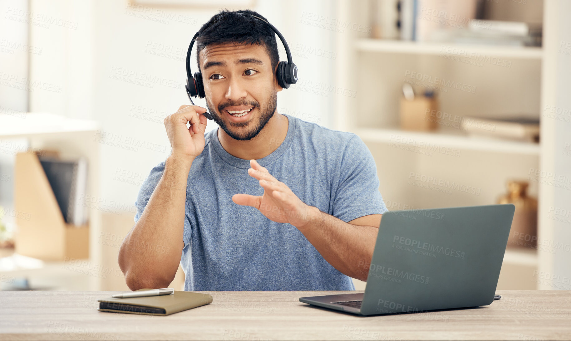 Buy stock photo Home office, laptop and man with headset in discussion for telemarketing, remote work and help to clients. Happy, agent and book with mic by desk for customer support, information and insurance sales