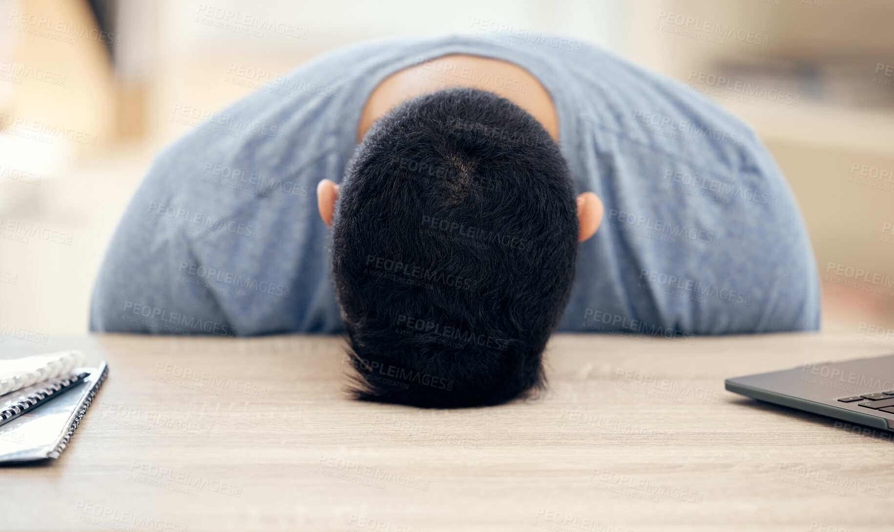 Buy stock photo Shot of an unrecognizable businessman sleeping at his desk at work