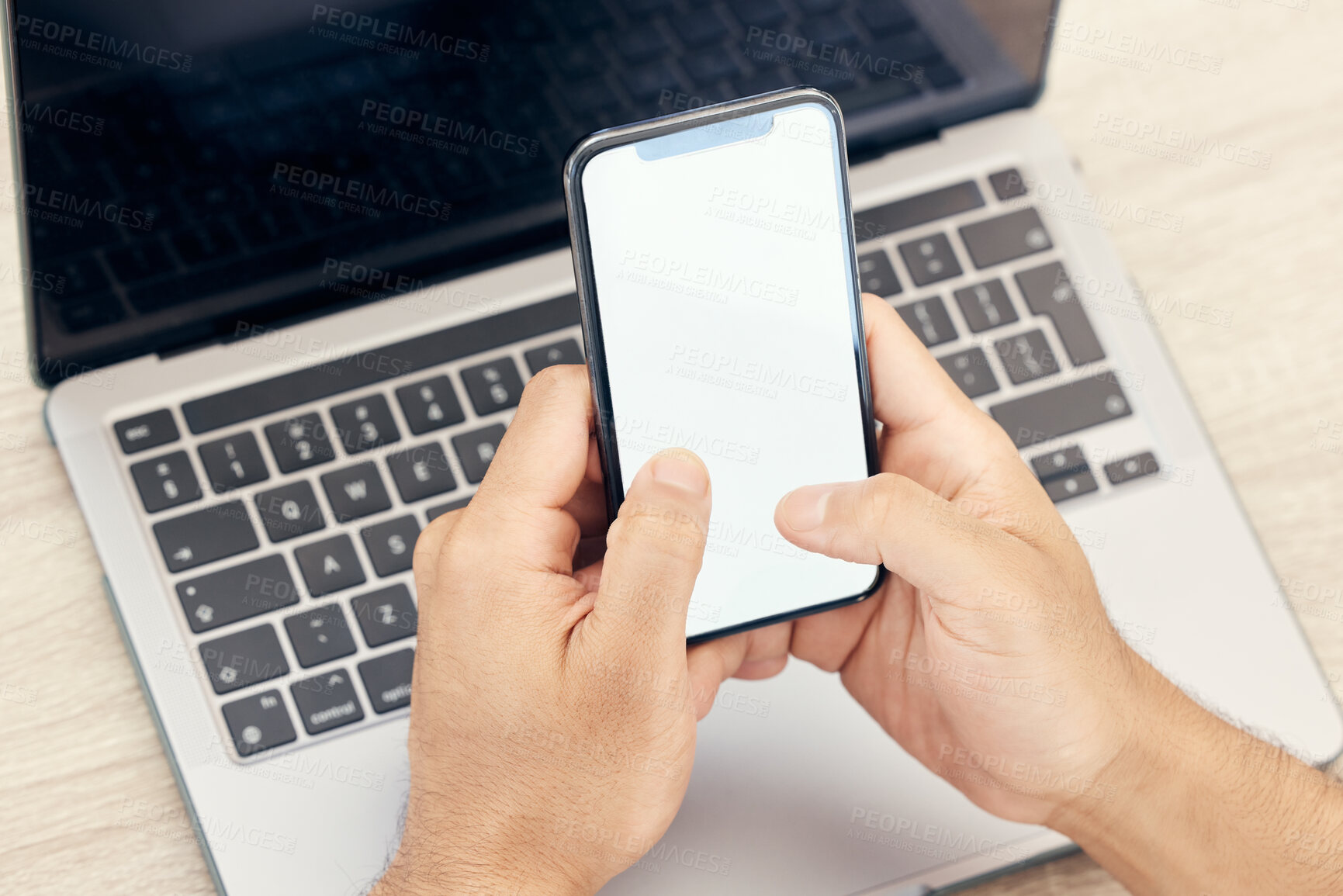 Buy stock photo Shot of an unrecognizable businessman using a phone in an office at work