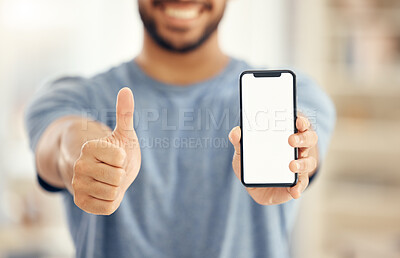 Buy stock photo Shot of an unrecognizable businessman showing a thumbs up while using a phone in an office at work