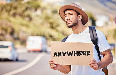 Buy stock photo Shot of a young man holding a sign that reads 