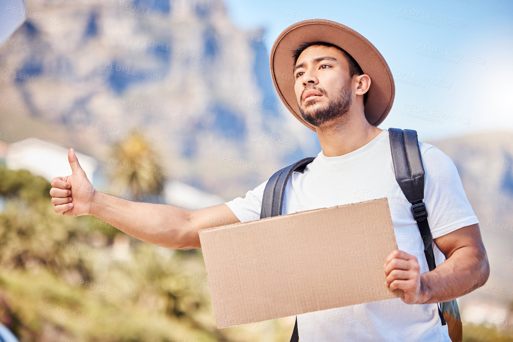 Buy stock photo Asian man, road and signboard with thumbs up for hitchhiking journey, trip fail and travel holiday in California. Tourist, backpack and stop cars or transport, desperate for ride with mockup space