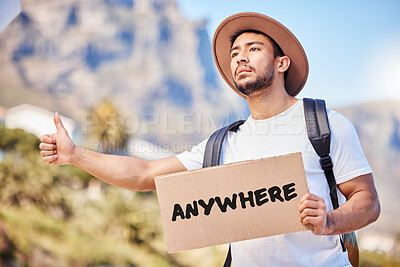 Buy stock photo Asian man, desperate and signboard with thumbs up for hitchhiking on journey, trip and travel for holiday in California. Tourist, sad and stop cars or transport for ride on vacation with text