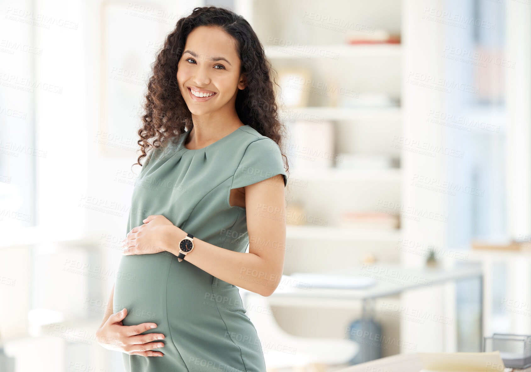 Buy stock photo Portrait, smile and a pregnant business woman in her office getting ready for maternity leave from work. Happy, mother and proud with a young female employee holding her stomach in the workplace