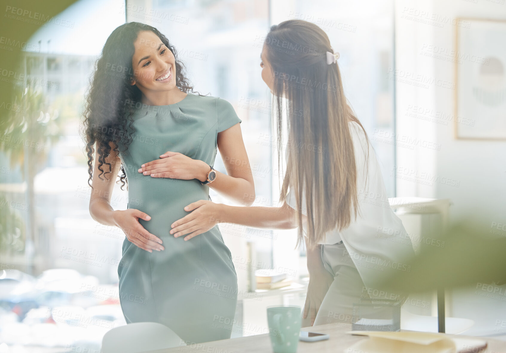 Buy stock photo Woman, pregnant and happy with colleague in office to touch stomach growth, new mother and meeting baby. Smile, people and abdomen with love, care and support of staff for maternity leave of wellness