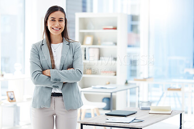 Buy stock photo Shot of a young businesswoman standing in an office at work