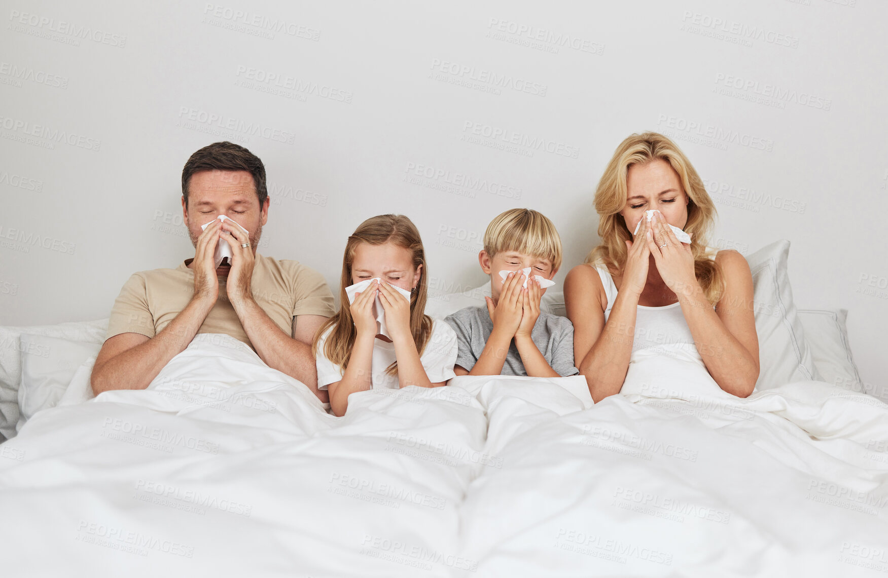 Buy stock photo Sick family, bedroom and blowing nose with tissue for flu, cold or viral infection in isolation together at home. Mother, father and children with fever, sneeze or virus for sinus or influenza in bed