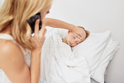 Buy stock photo Shot of a mother caring for her sick daughter at home