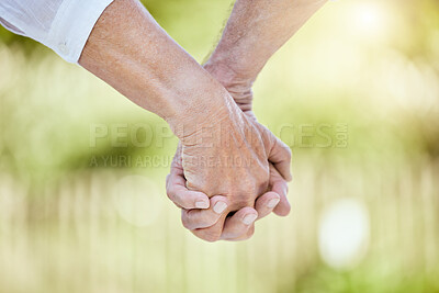 Buy stock photo Mature couple, love and holding hands in nature for care, support and commitment in relationship. Marriage, gesture and people in park for wellness, trust and help in retirement with romance or faith