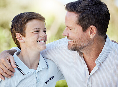 Buy stock photo Shot of a man spending time outdoors with his young son
