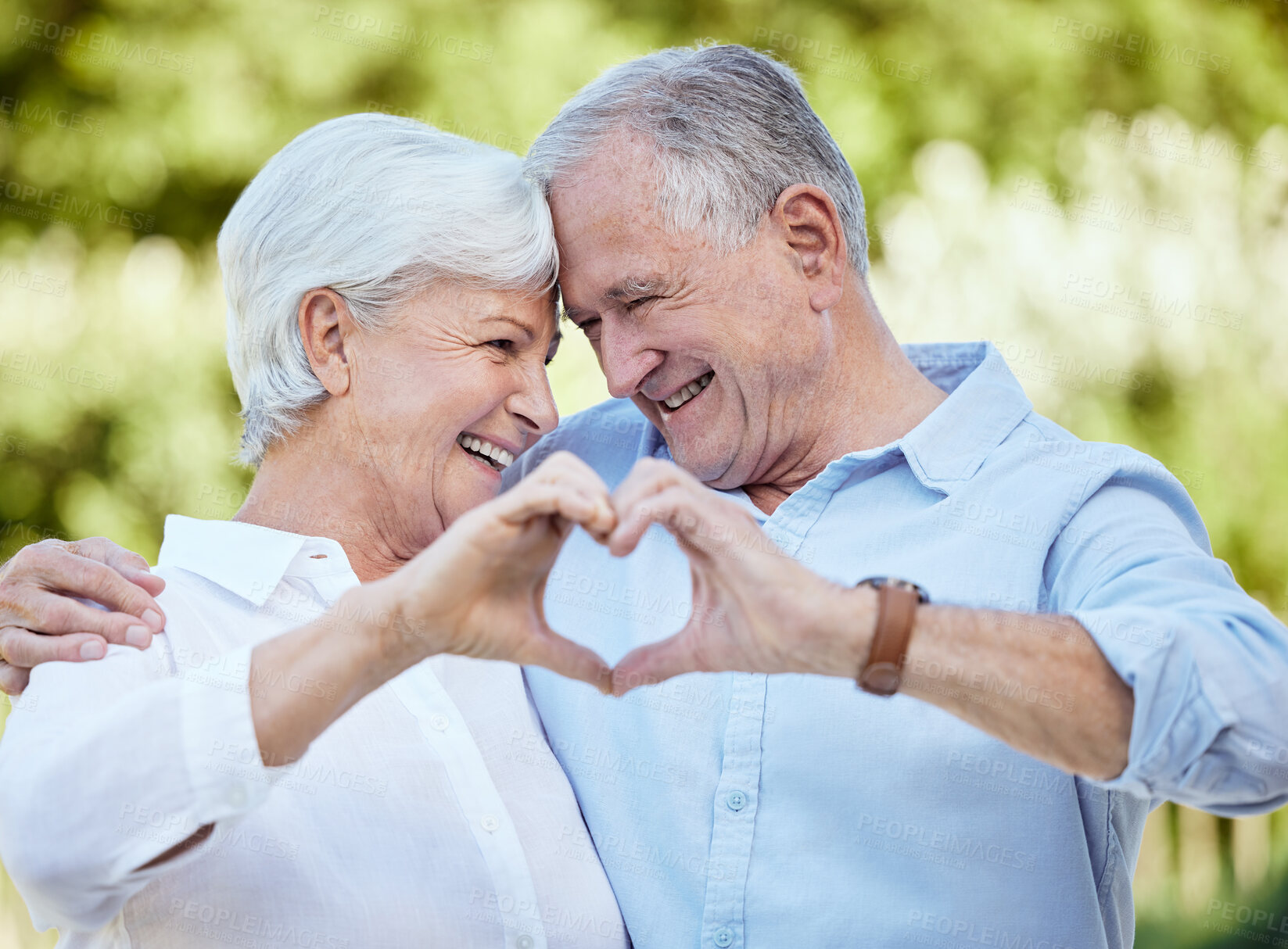 Buy stock photo Love, heart hands and happy senior couple outdoor for support, care and trust emoji. Nature, man and woman with sign for romance, marriage commitment and connection for relationship on valentines day