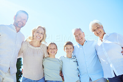Buy stock photo Shot of a multi-generational family spending time together outdoors