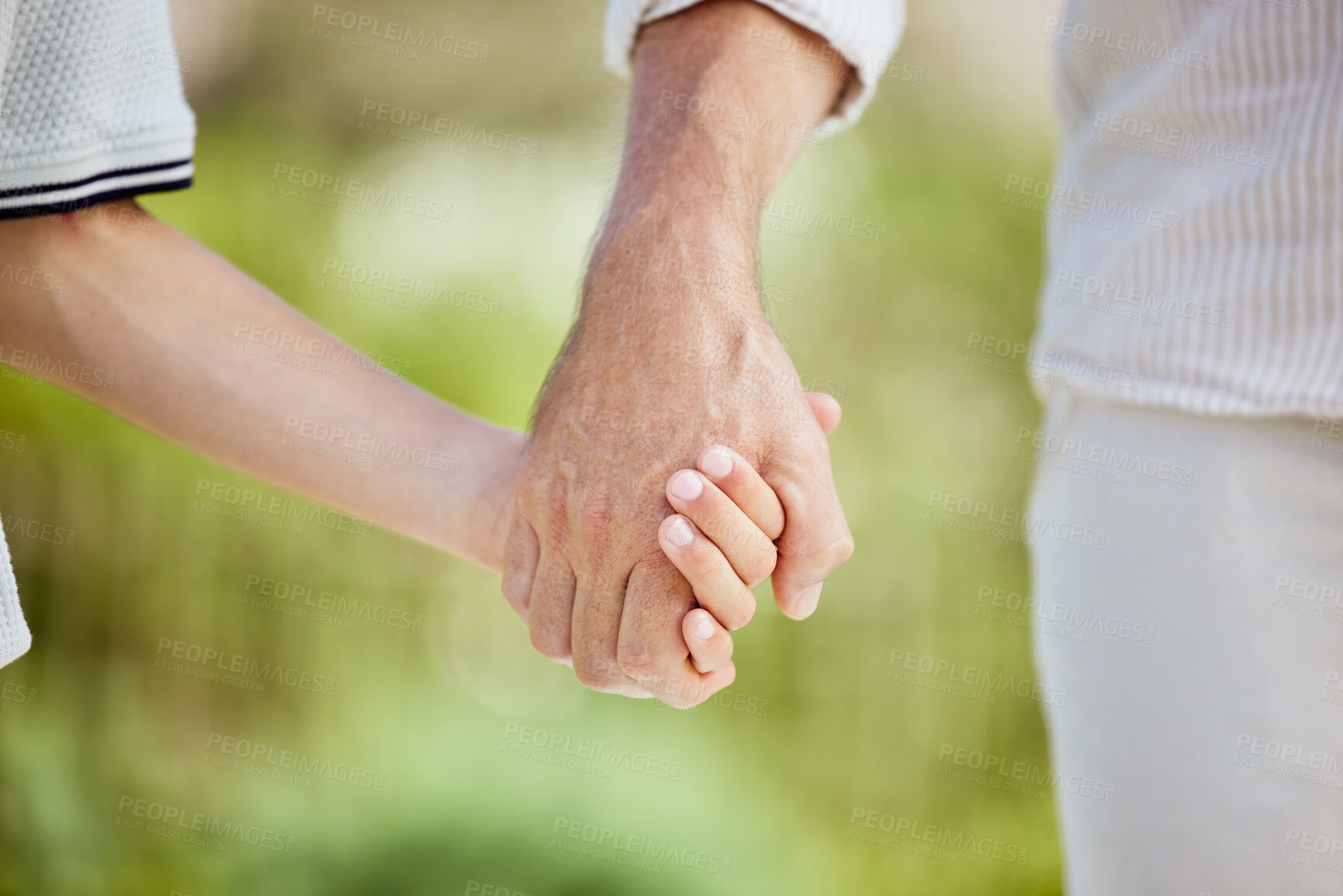 Buy stock photo Holding hands, outdoor and walking in nature, family and bonding of parent with child, calm and support. Garden, care and trust of kid with dad, person and youth in park, love or affection in weekend