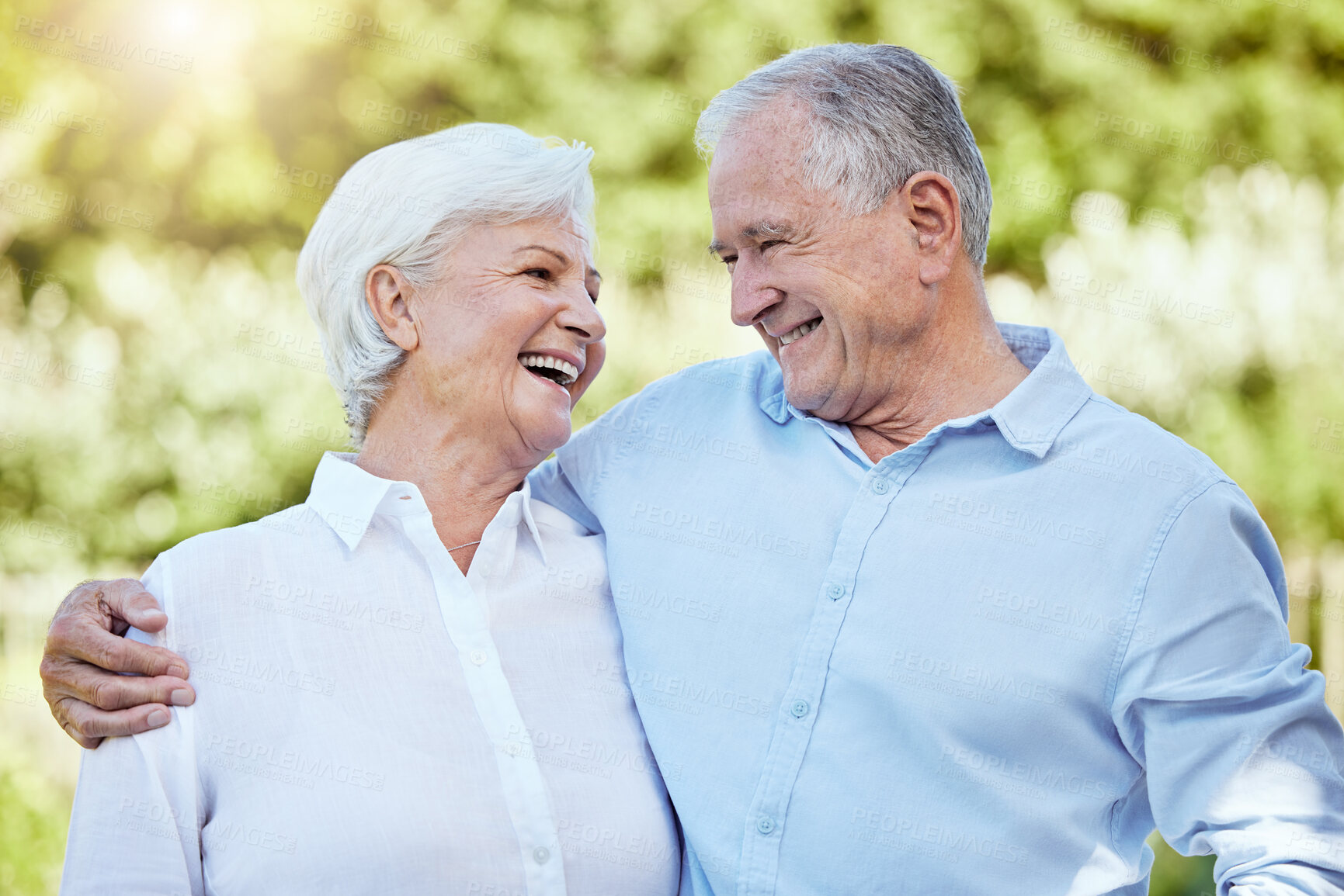 Buy stock photo Laughing, hug and senior couple in nature for support, care and funny joke in retirement together. Smile, man and woman embrace outdoor for romance, comedy and connection for relationship on date