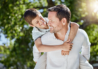 Buy stock photo Shot of a man spending time outdoors with his young son
