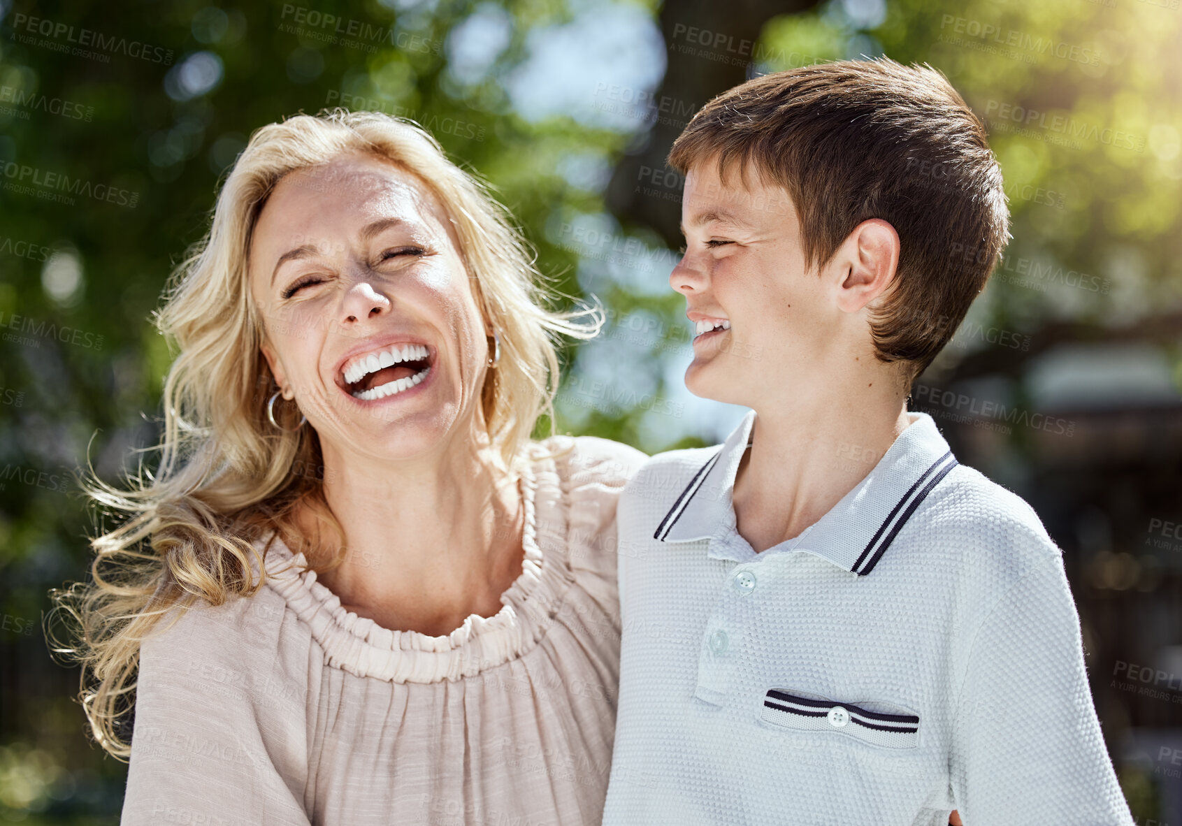 Buy stock photo Shot of a woman spending time outdoors with her young son