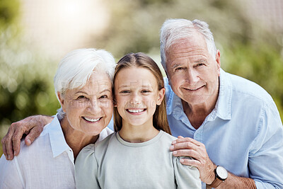 Buy stock photo Shot of a little girl spending time outdoors with her grandparents