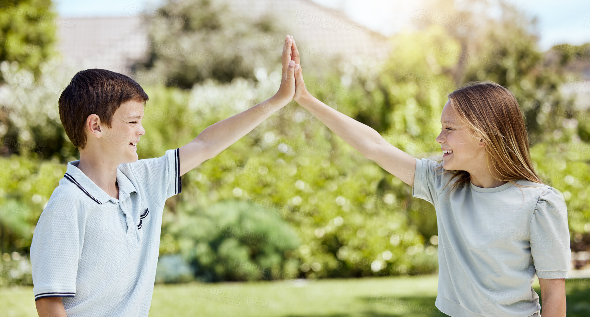 Buy stock photo High five, smile and children in park, outdoor and happy in nature, celebration and bonding of girl and boy. Spring, success and siblings in environment, hands and kids in backyard, break and weekend