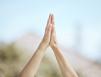 Buy stock photo Cropped shot of a young boy and girl giving each other a high-five while standing outside