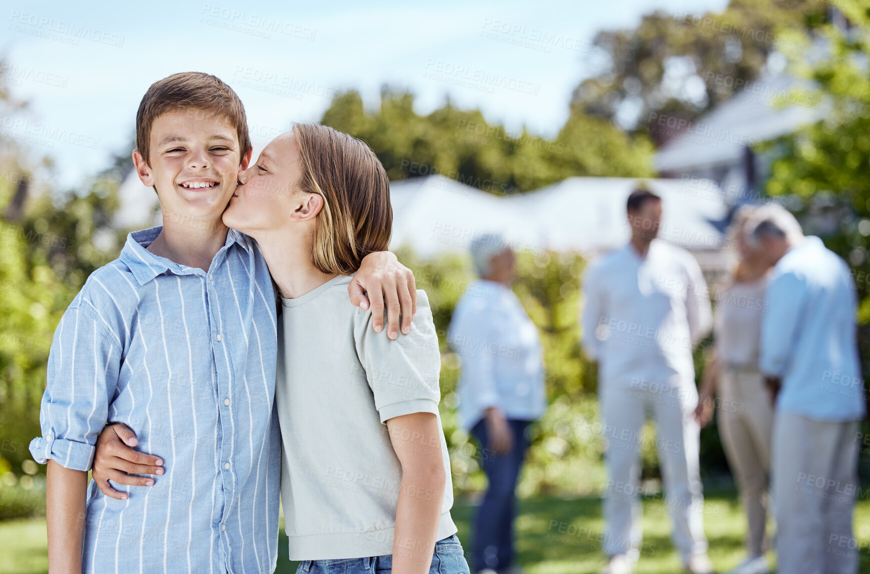 Buy stock photo Happy children, siblings or hug with kiss on cheek in nature for outdoor weekend, holiday or bonding together. Young kids, brother or sister with smile for family love, youth or childhood in backyard